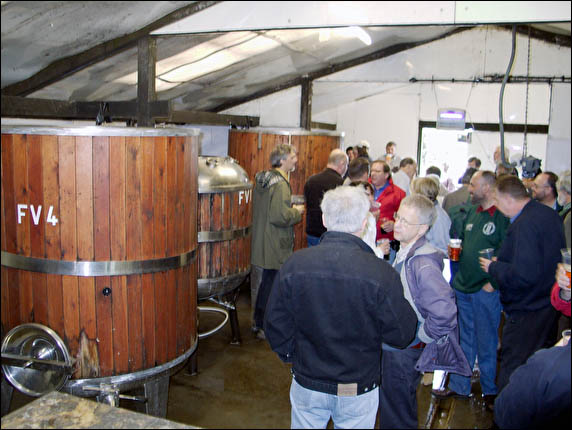 CAMRA group sampling beer in brewery