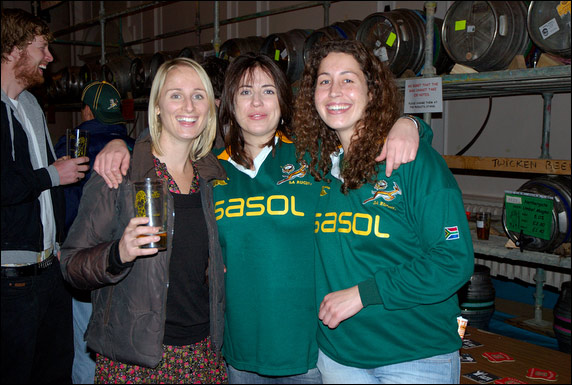 Three girls (2 wearing Springboks Rugby shirts) enjoying the festival