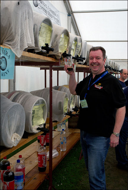 Ian Winfield filling a glass