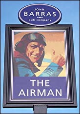 The Airman swinging sign